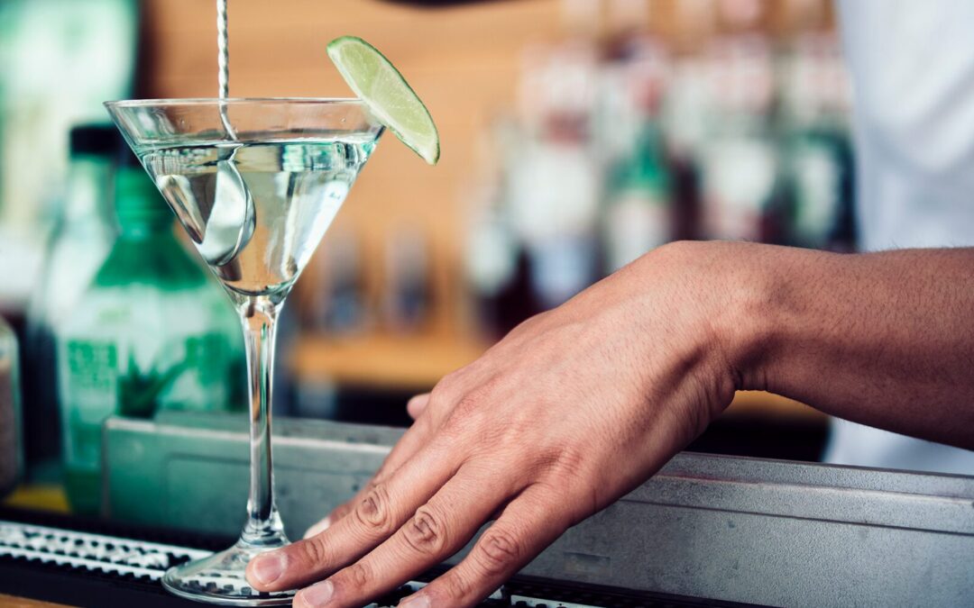 cocktail being prepared at a bar