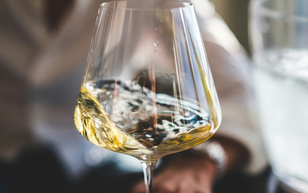 Close-up of white wine swirling in a glass