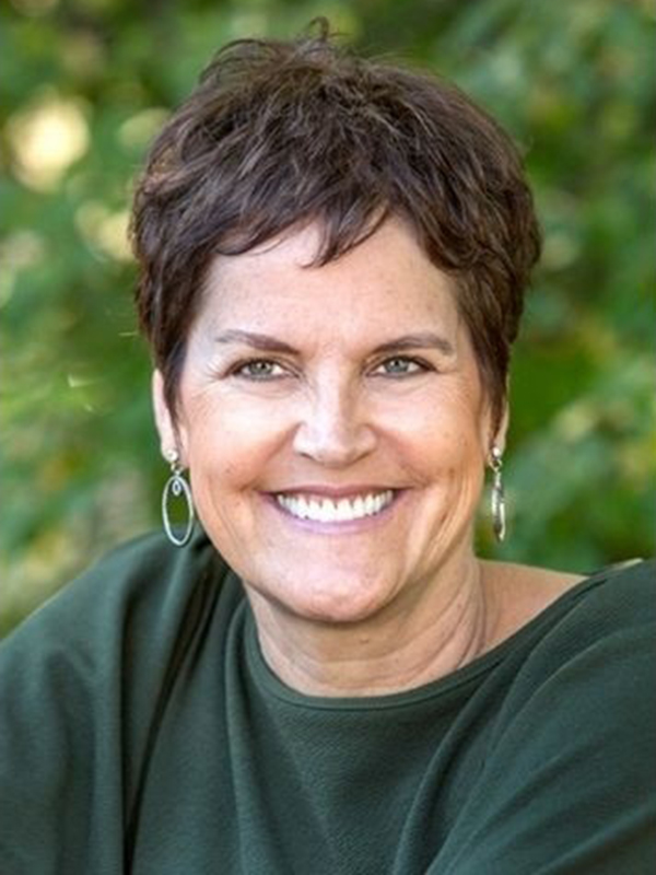 Allison Hardin smiling warmly outdoors