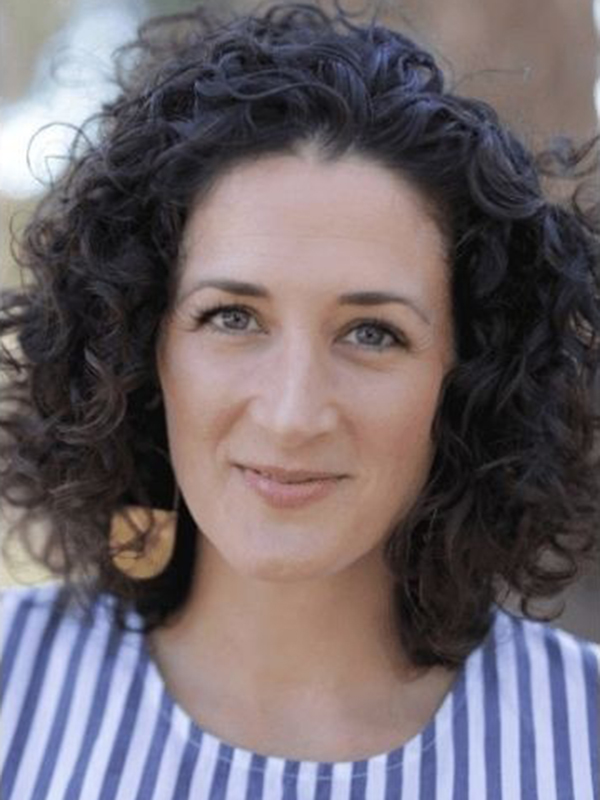 Lacey Young smiling gently in natural light