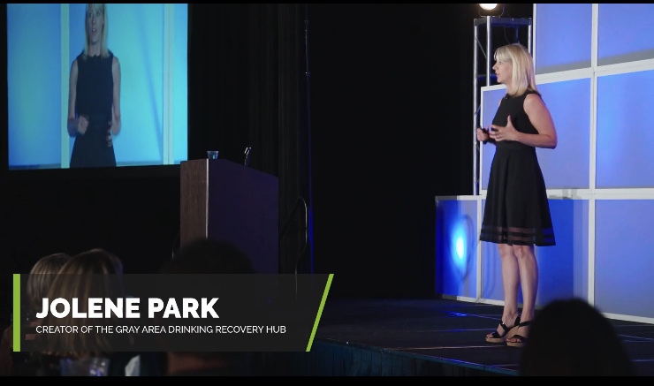 Jolene Park speaking at a podium about Gray Area Drinking